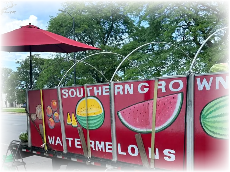 The Southern Grown watermelon truck parked at 83rd and Stony Island, melons stacked on the tarp