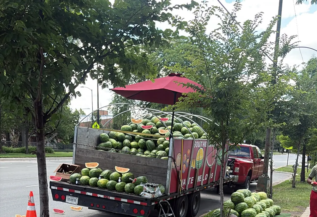 The watermelon truck and melon piles along Stony Island Avenue